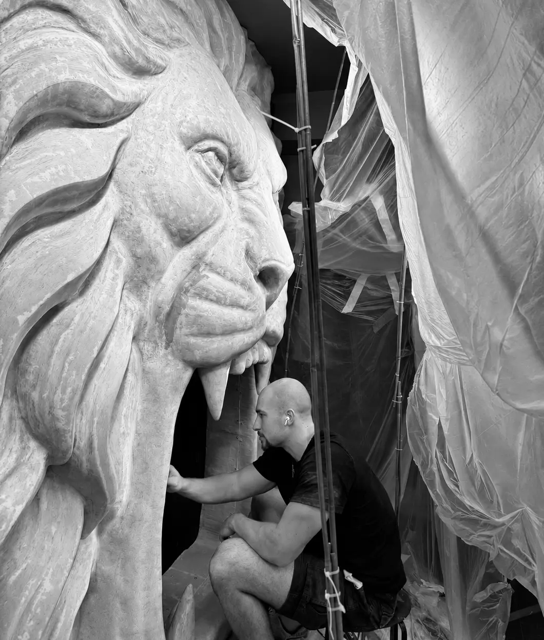 Nicholas Finn, founder of DeGenerate Apps, beside his Chelsea lion sculpture